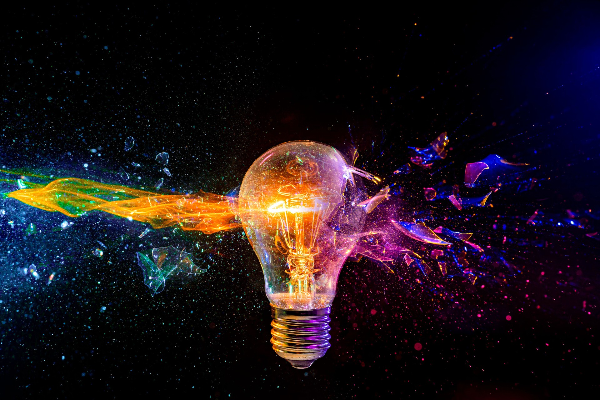 Exploding light bulb with colorful fragment splash